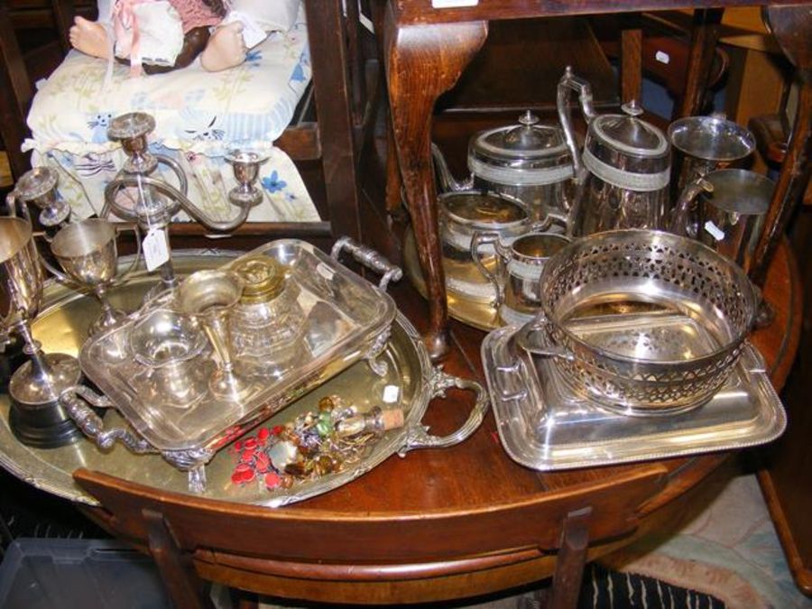 A medley of silver plated items