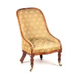 A 19TH CENTURY ROSEWOOD UPHOLSTERED CHAIR with hooped back; standing on reeded legs with under