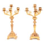 A PAIR OF LATE 19TH CENTURY ORMOLU GILT BRASS FOUR BRANCH CANDELABRA with leaf cast decoration and