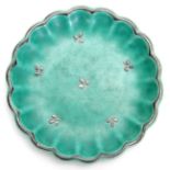 A GUSTAVSBERG, SWEDEN SHALLOW GREEN GLAZED SCALLOP-EDGE SMALL DISH with silver delicate flower spray