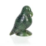 A SPINACH GREEN CARVED JADE FIGURE OF A BIRD 5.5cm high