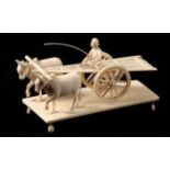 AN INDIAN IVORY SCULPTURE modelled as an ox drawn cart 12.5cm wide