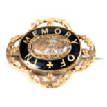 A VICTORIAN MOURNING BROOCHwith ornate gilt case with black enamel border with the message