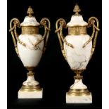 AN IMPRESSIVE PAIR OF FRENCH ORMOLU MOUNTED VEINED WHITE MARBLE CASOLETTES with floral swag work