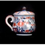 AN ORIENTAL IMARI PATTERN SIDE HANDLED LIDDED POT 7.5cm high