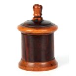 A 19TH CENTURY LIGNUM VITAE STRING BOX of turned cylindrical form with incised lid and raised knop