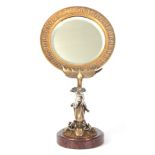 A LATE 19TH CENTURY FRENCH GILT BRONZE DRESSING TABLE MIRROR with circular moulded edge frame