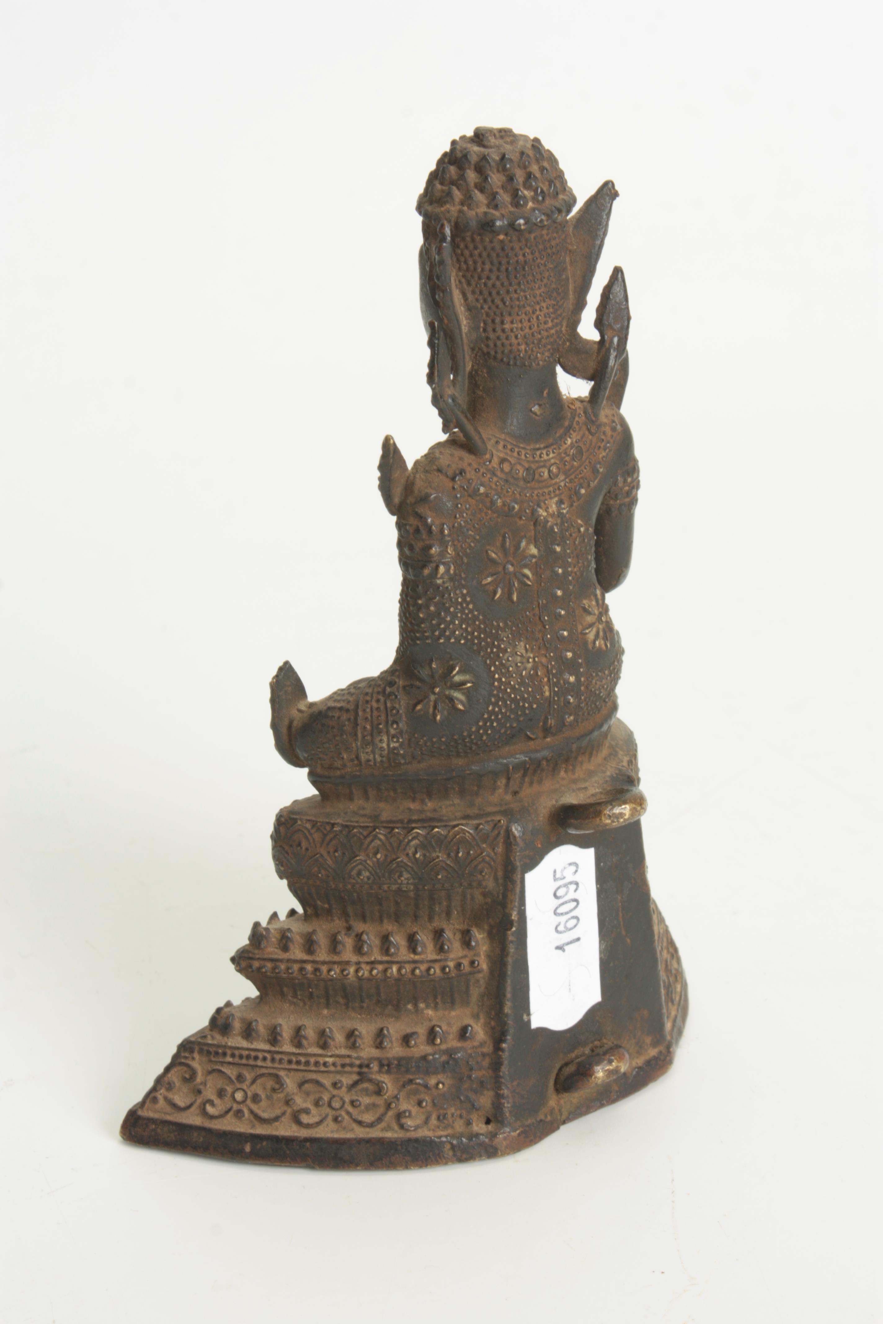 A TIBETAN BRONZE SEATED BUDDHA 14cm high. - Image 6 of 6