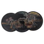 A 19TH CENTURY CARVED EBONY CHINESE INK BLOCK decorated with figures in a village setting and