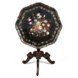 A 19TH CENTURY PAPIER MACHE TILT TOP OCCASIONAL TABLE with a scalloped edge top decorated with