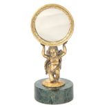 AN EARLY 20TH CENTURY GILT BRONZE DRESSING TABLE MIRROR with engraved circular frame supported by
