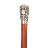 A 19TH CENTURY MALACCA AND SILVER MOUNTED WALKING STICK decorated with dragon and floral work pommel
