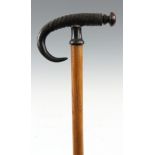 AN EARLY 20th CENTURY GOAT HORN HANDLED WALKING CANE mounted on tapering oak stick with steel