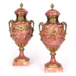 A PAIR OF EARLY 20TH CENTURY FRENCH MARBLE AND ORMOLU MOUNTED CASOLETTS with domed tops surmounted