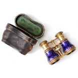 FLAMMARION A PAIR OF ORMOLU AND BLUE ENAMEL OPERA GLASSES with cast leaf work decoration to the