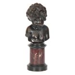 A 19TH CENTURY FRENCH BRONZE BUST OF A CHERUB mounted on a rouge marble and black slate turned socle