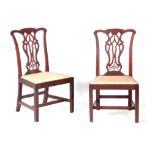A PAIR OF GEORGE III MAHOGANY CHIPPENDALE STYLE SIDE CHAIRS with pierced back splats and drop-in