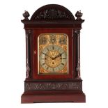 A LATE 19TH CENTURY QUARTER CHIMING TRIPLE FUSEE BRACKET CLOCK the large mahogany case with arched