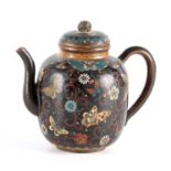 A JAPANESE MEIJI PERIOD CLOISONNE TEAPOT decorated with butterflies amongst scrollwork foliage,