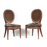 A PAIR OF 19TH CENTURY MAHOGANY HEPPLEWHITE STYLE UPHOLSTERED SIDE CHAIRS with oval backs and