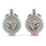 A LARGE PAIR OF 19TH CENTURY CHINESE FAMILLE ROSE MOON FLASK. Decorated in coloured enamels with