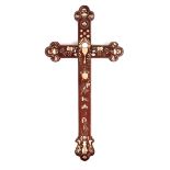 A CHINESE ROSEWOOD AND MOTHER OF PEARL INLAID APOSTLE CRUCIFIX having intricate floral inlays