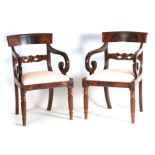 A PAIR OF REGENCY MAHOGANY OPEN ARMCHAIRS with flamed top rails above leaf carved stretchers and