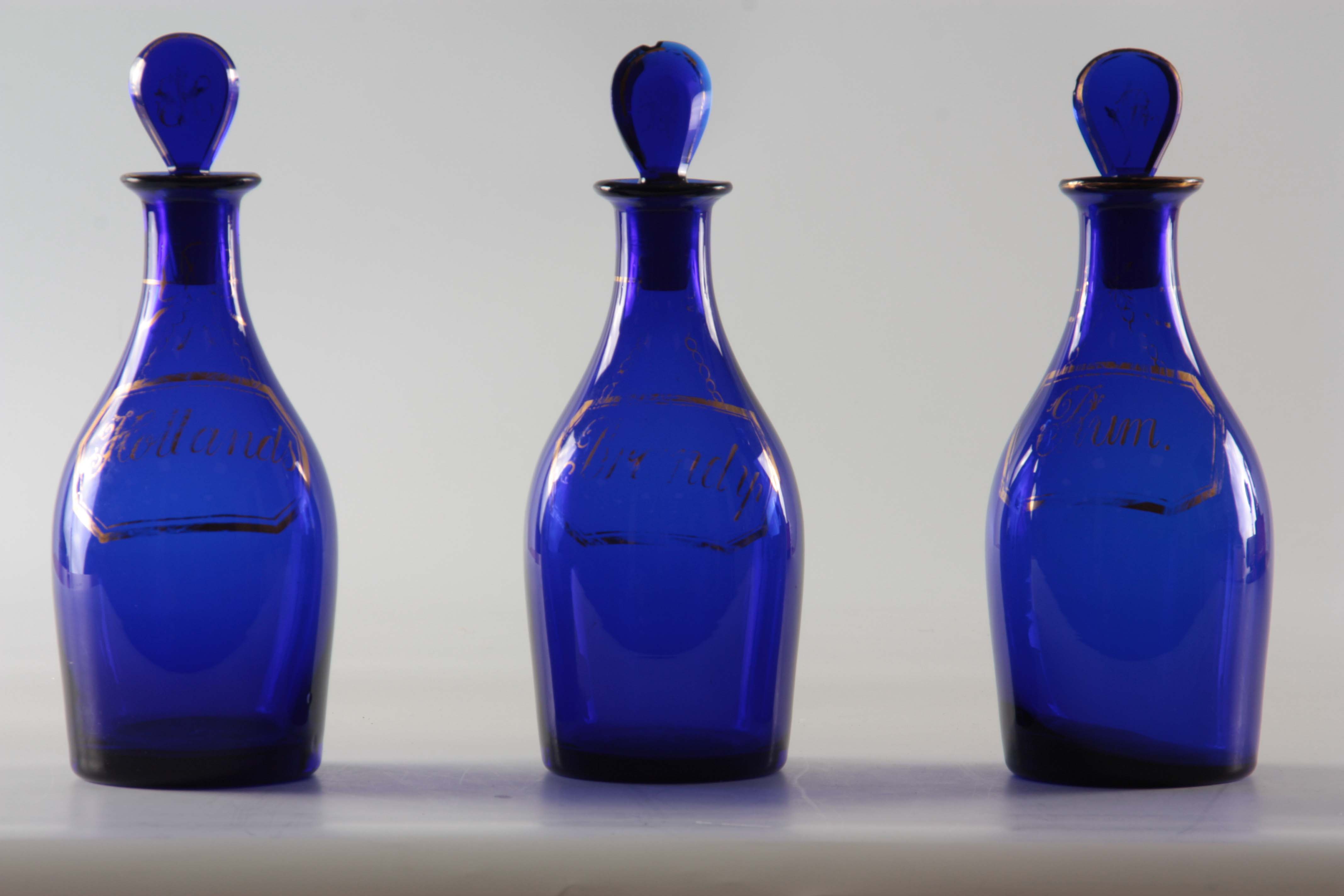 A SET OF THREE EARLY 19TH CENTURY BRISTOL BLUE GLASS DECANTERS for Rum, Brandy and Hollands with - Image 3 of 7