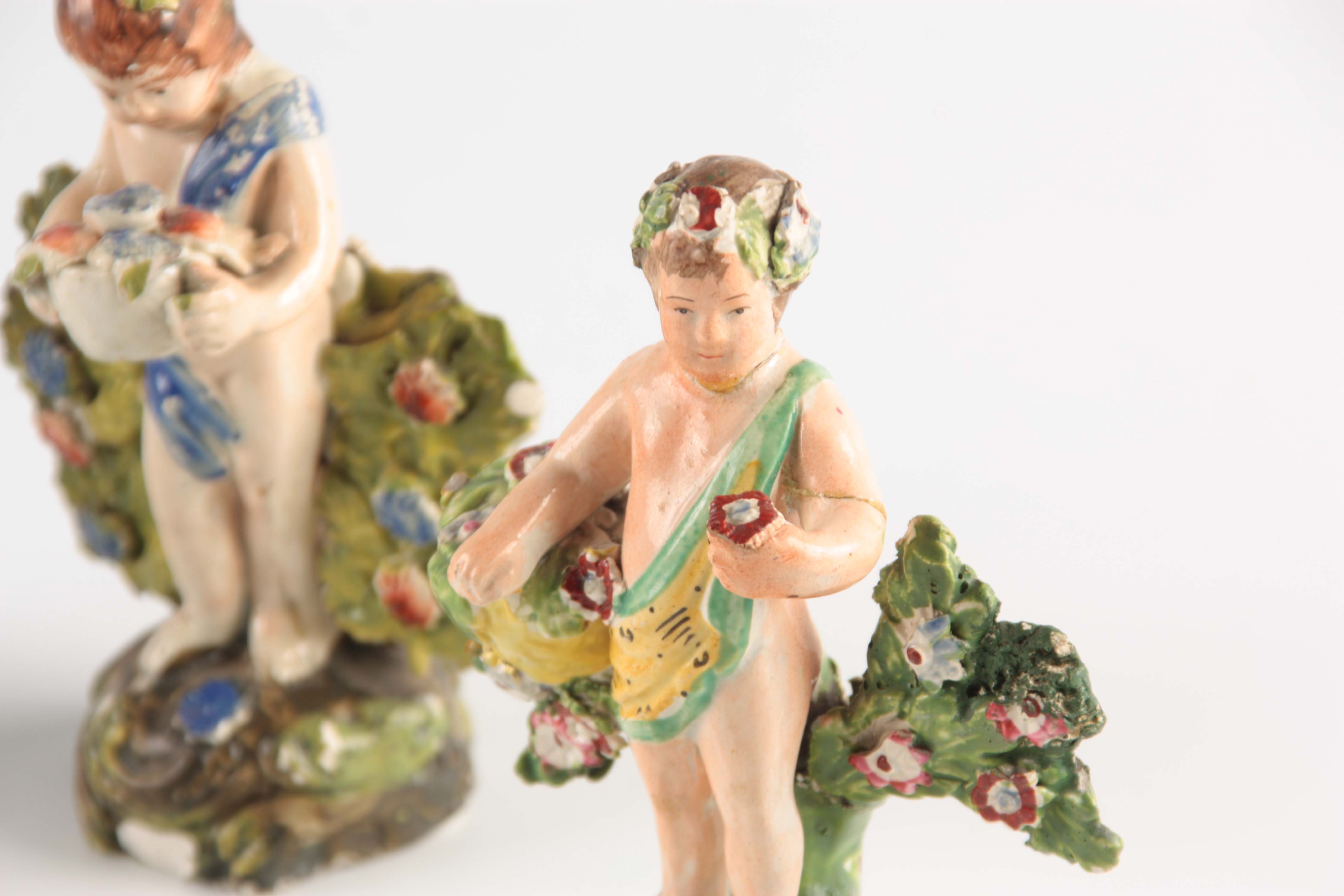 A SELECTION OF FOUR EARLY 19TH CENTURY STAFFORDSHIRE PEARLWARE FIGURES of cherubs holding various - Image 4 of 5