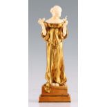 LOUIS BARTHELEMY. AN EARLY 20TH CENTURY FRENCH GILT BRONZE AND IVORY SCULPTURE modelled as a