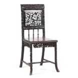 A 19TH CENTURY FINELY CARVED CHINESE HARDWOOD SINGLE CHAIR having pierced back with birds in