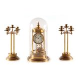 AN EARLY 20TH CENTURY MERCURY PENDULUM 400 DAY BANDSTAND TORSION CLOCK GARNITURE the brass domed top