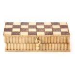 AN EARLY 19TH CENTURY ENGRAVED BONE PRISONER OF WAR GAMES BOX having reeded sides and hinged