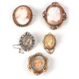 A COLLECTION OF FOUR CAMEO BROOCHES AND TWO MINIATURE PORTRAITS ON IVORY the largest measuring 7cm