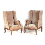 A PAIR OF 19TH CENTURY OVERSIZED STAINED BEECH UPHOLSTERED ARMCHAIRS with leaf carved rococo style