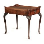 AN EARLY 18TH CENTURY MAHOGANY SILVER TABLE with moulded raised corners above a short grain veneered
