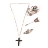 A SILVER AND GEM SET CRUCIFIX, POSSIBLY SAPPHIRES, and A COLLECTION OF THREE SILVER BROOCHES the