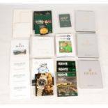 A COLLECTION OF 22 VARIOUS ROLEX BOOKS AND CATALOGUES including retail brochures, price guides