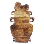 A LARGE CHINESE CARVED RUSSET JADE URN the lid with a dog of foo resting on top, the body having