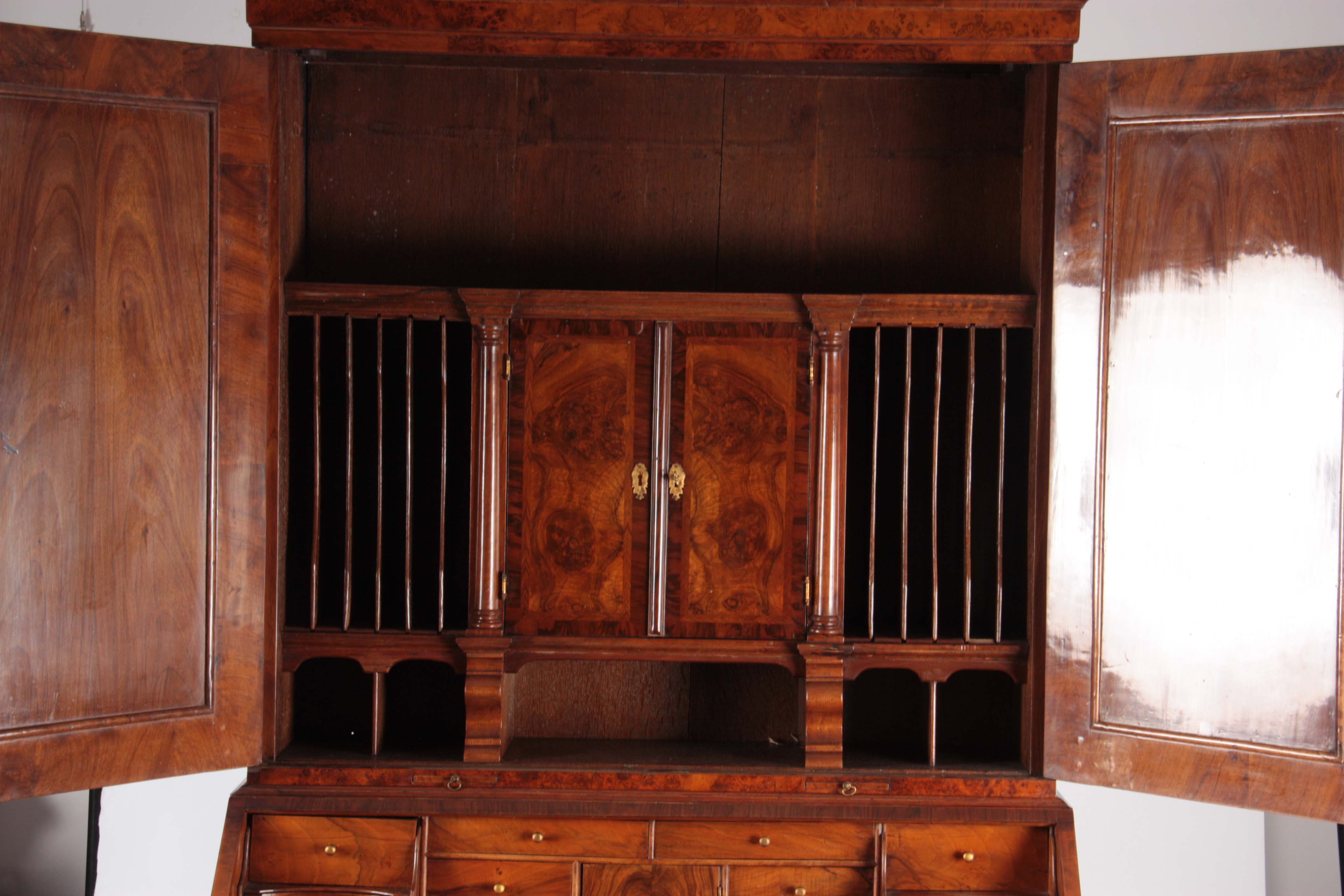 A WILLIAM AND MARY BURR WALNUT BUREAU BOOKCASE with broken arch pediment above shaped mirrored doors - Image 10 of 14