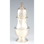 A GEORGE V SILVER SUGAR CASTER of baluster form and footed base by Atikin Bros, Sheffield, 1919,