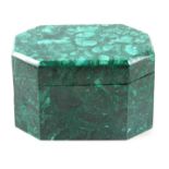 A 20TH CENTURY MALACHITE CASKET of octagonal form with hinged lid 22.5cm wide 14.5cm deep 14cm high.