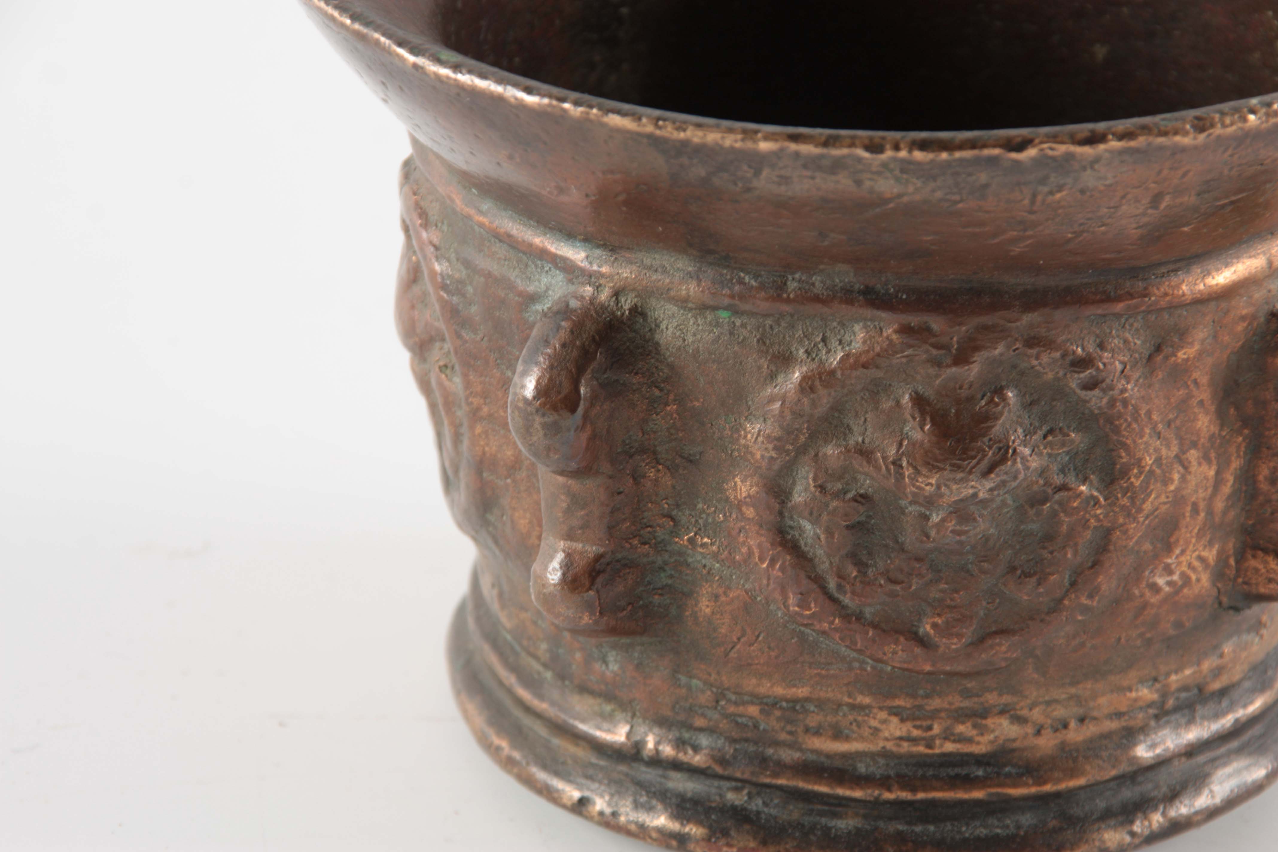 A 17TH CENTURY BRONZE MORTAR with shaped side handles and cast medallions 10cm high 14cm diameter. - Image 2 of 4