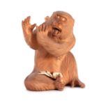 A FINE LATE 19TH CENTURY JAPANESE MEIJI CARVED BOXWOOD SCULPTURE OF A MONKEY depicted seated hands
