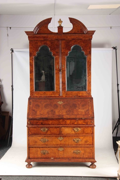 A WILLIAM AND MARY BURR WALNUT BUREAU BOOKCASE with broken arch pediment above shaped mirrored doors - Image 2 of 14