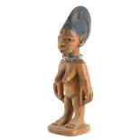 AN AFRICAN CARVED YORUBA FEMALE IBEJI with bead decoration 23cm high - From the George Chemeche