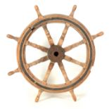 A 19TH CENTURY BRASS BOUND OAK SHIP'S WHEEL with turned spindles 120cm diameter