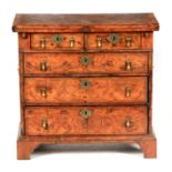 A WILLIAM AND MARY STYLE HERRING-BANDED BURR WALNUT BACHELORS CHEST with cross-banded hinged top