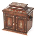 A 19TH CENTURY ROSEWOOD AND MOTHER OF PEARL TABLE CABINET with angled moulded top above two panelled