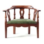 AN UNUSUALLY LARGE 18TH CENTURY BISHOPS THRONE WALNUT CORNER CHAIR with hooped armrest and raised